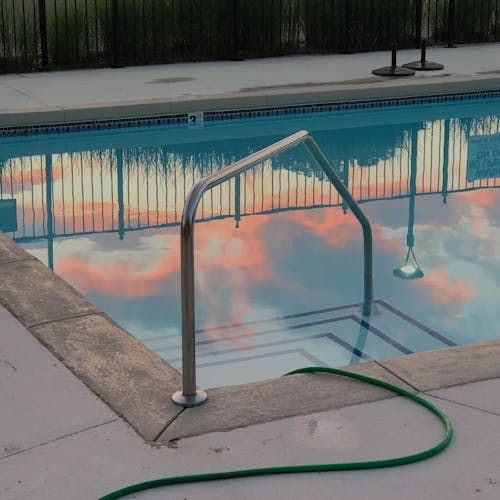 A hose running into a pool 