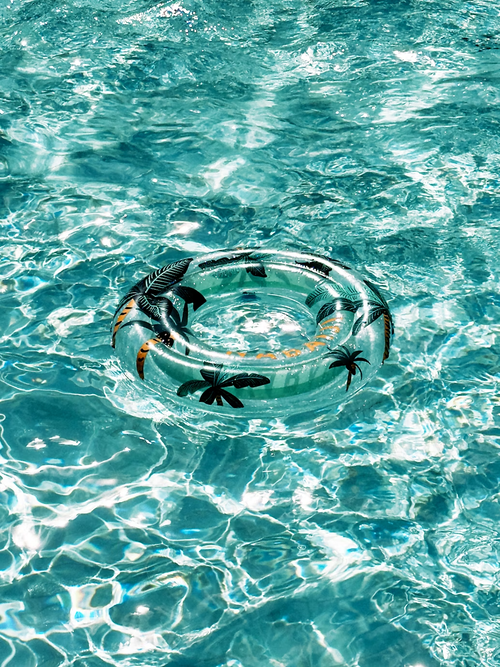 A pool with a ring floating.